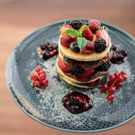 Address Istanbul Hotel Eksteriør billede A stack of pancakes with fruit